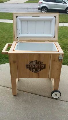 an ice chest sitting on top of a sidewalk