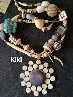 "Kiki" Wear a one of a kind piece of art!   A unique large carnelian and white turquoise pendant is the wow focal point of this necklace. Shell, a variety of turquoise, African beads and wood add the uniqueness of the piece.  I also added horn, sketched white coral and Bali silver. A funky dangle is a eye catcher. Make some room in your jewelry box for art.  23" from end to end. Hook closure. In a rush to strut your new bling...no worries. I ship fast. Your jewelry should always make you smile... Item #522 Bohemian Round Natural Necklaces, Eclectic Handmade Necklaces With Round Beads, Artisan Beaded Necklace With Large Pendant, Handmade Eclectic Necklaces With Round Beads, Handmade Artisan Necklaces In Natural Color, Handmade Eclectic Necklace With Round Beads, Bohemian Agate Necklace With Large Pendant, Bohemian Jewelry With Large Natural Beads, Unique Beaded Necklaces With Gemstone Round Pendant