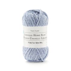 the yarn ball is blue and has white lettering on it, which reads crochet home