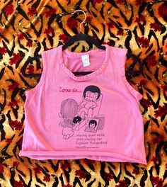 The "Love Is..." cartoons by Kim Casali are the cutest! Rare Vintage 1970s LOVE IS... Englebert Humperdinck Cartoon Graphic Cut-off Tank Top  T-Shirt Brand: Gaymode JCPenney  Size Medium  length: 16 inches  Chest: 36 inches  waist: 34 inches  armhole: 7.5 inches 1970s T Shirts, Englebert Humperdinck, Love Is, Top T Shirt, Shirt Brand, Vintage 1970s, Graphic Tank, Cut Off, Womens Clothing Tops