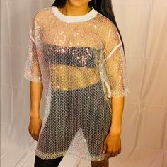 Holographic Sequin Sheer Mesh Top (Can Be Worn As A Cover Up Or Dress) Fabric: Polyester Model Is Wearing A Small Summer Short Sleeve T-shirt With Sequins, Spring Crew Neck T-shirt With Sequins, Spring Sequined Crew Neck T-shirt, Spring Sequins Crew Neck T-shirt, Summer T-shirt With Sequins And Short Sleeves, Summer Sequined Short Sleeve T-shirt, Summer Graphic Print Mesh Top With Short Sleeves, Summer Graphic Print Mesh Top With Crew Neck, Summer Graphic Print Short Sleeve Mesh Top