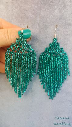 These unique designer lace earrings were made by me according to my idea through many trial and error. This is my author's invention: the combination of lace top and fringe. I made these earrings in different colors. I can also make your favorite color and in your length size. Color:  sparkling emerald .  Copy without my permission is prohibited  For those who want to buy my copyright scheme-tutorial  for these earrings: https://www.etsy.com/uk/listing/1020331857 100% hand made with love! Measurements: Length with hook - about 10 cm ( 4 inch ),Width -4 cm (1.6 inch) Materials: Silver  plated ear hooks Czech glass beads Tytan Thread Beaded Bohemian Chandelier Earrings For Party, Bohemian Beaded Chandelier Earrings For Party, Unique Beaded Drop Earrings For Party, Handmade Green Earrings For Party, Beaded Dangle Chandelier Earrings For Party, Unique Beaded Chandelier Earrings For Party, Unique Party Earrings With Dangling Beads, Handmade Green Chandelier Earrings For Party, Green Chandelier Earrings For Party