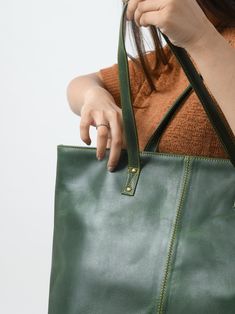 Trustpilot This Kim Tote is a yet stylish women's tote handbag that is a great choice for a trendy look. The simple classic design in green color makes it superior. The zipper gives easy access to the main compartment which has one small zipper pocket inside the compartment for keeping your accessories and other small items securely and separately. This women's leather tote bag is made of the finest quality buffalo leather accentuated with intricate detailing on the stitches. We offer excellent Green Shoulder Bag For Shopping, Green Shoulder Bag With Zipper For Daily Use, Green Bag With Zipper For Daily Use, Green Bag With Zipper Closure For Daily Use, Green Everyday Bag With Zipper Closure, Classic Shopping Bag With Zipper Pocket, Green Everyday Satchel With Zipper Pocket, Everyday Green Satchel With Zipper Pocket, Classic Shopping Bags With Zipper Pocket