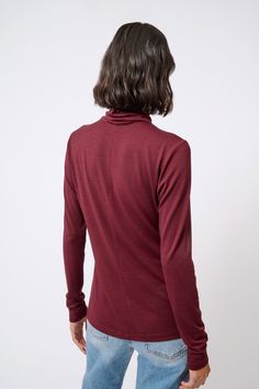 For all you non-wool lovers, we found the finest of Italian brushed jerseys to create this new essential for your Fall wardrobe. With a center front and center back seam, this style has a long turtleneck and long sleeve for extra gathering, the perfect Length for easy layering, and soft hand finish to make it your favorite.ESTIMATED DELIVERY 8/15/22 Center front and center back seams, long turtleneck with clean finish, longer sleeve length. - 83% Polyester, 14% Viscose, 3% Elastin - Fabric woven Winter Funnel Neck Turtleneck With Thumbholes, Winter Turtleneck With Thumbholes And Funnel Neck, Winter Long Sleeve Sweater With Thumbholes, Long Sleeve Merino Wool Turtleneck For Fall, Winter Sweater With Thumbholes And Long Sleeves, Merino Wool Long Sleeve Turtleneck For Fall, Long Sleeve Sweater With Thumbholes For Fall, Winter Long Sleeve Top With Thumbholes For Layering, Winter Turtleneck Mock Neck Top With Thumbholes