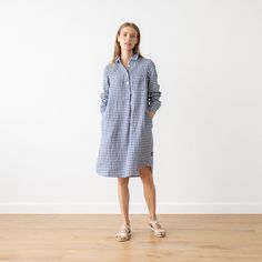 Loose Fit Linen Dress Camilla, long sleeves with pockets. Prewashed, super soft 100% European linen, no shrinkage. Blue and white or navy with white checked linen. With a fluid, drapey silhouette and long sleeves, our Camilla linendress is versatile, comfortable and effortlessly stylish. Thanks to the understated gathered detailing to the cuffs and back, delicate buttons and two handy pockets, this linen dress works as beautifully on a summer picnic as in the office. DETAILS: * Made in Lithuania Long Sleeve Plaid Cotton Shirt Dress, Spring Plaid Long Sleeve Shirt Dress, Plaid Long Sleeve Shirt Dress For Spring, Casual Gingham Long Sleeve Dress, Casual Long Sleeve Gingham Dress, Plaid Long-sleeve Dresses With Pockets, Plaid Long Sleeve Dress With Pockets, Long Sleeve Plaid Dress With Pockets, Linen Gingham Dress For Daywear