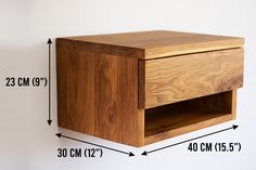 a wooden shelf with measurements for the top and bottom