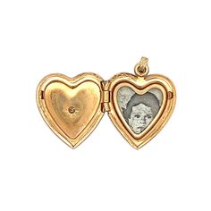 Relive the charm of the Victorian era with this heart-shaped locket pendant. Crafted from 14 karat yellow gold, this antique locket opens to hold a cherished memento, making it a perfect keepsake for treasured memories. At the center of the locket is a single cut diamond, flush set to highlight its natural beauty and a hint of sparkle. Keepsake Medallion Jewelry With Heart Charm, Keepsake Double Heart Locket Jewelry, Keepsake Pendant Locket Necklace With Heart Charm, Heart Charm Pendant Locket Necklace As Keepsake, Keepsake Medallion Locket Necklace With Heart Charm, Heart Charm Medallion Locket Necklace Keepsake, Classic Locket Necklace With Charms For Gift, Heart Charm Pendant Locket For Anniversary, Heart Charm Pendant Locket Necklace For Anniversary