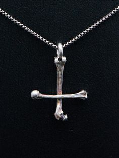 Silver bone cross necklace, sterling silver round venice chain included.This handmade dark art gothic cross is made from 925 sterling silver with oxidated details.Each piece is made to meet customers desires, so let me know if you want something special included your very own version.Golden version is possible also!Pendants first class finish has a lifetime guarantee and it will be renewed when needed with a cost of postage. Jewelry will be sent with FedEx International Economy, shipment is incl Gothic Sterling Silver Crucifix Necklace, Gothic Sterling Silver Cross Necklace, Petrine Cross, Black Metal Necklace, Upside Down Cross, Gothic Cross, Gothic Crosses, Small Skull, Metal Necklace