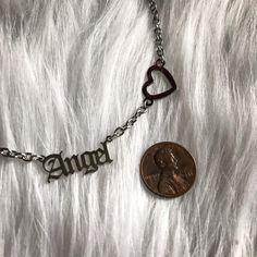 You can select this chain with the heart ( pictured on the angel chain or without like the baby chain). This is a strong yet delicate looking chain. It's completely made of stainless steel so it's much stronger and harder to scuff/tarnish than other metals. The Baby and Angel charms are tiny and cute! They are one inch in length. See size comparison picture. *DISCLAIMER: all my jewelry and handmade objects are NOT intended for children or to be used by them. All present a possible choking hazard Personalized Dainty Stainless Steel Necklaces, Dainty Personalized Stainless Steel Necklace, Personalized Dainty Stainless Steel Necklace, Personalized Dainty Stainless Steel Charm Necklaces, Custom Name Stainless Steel Necklaces For Everyday, Custom Name Stainless Steel Necklace For Everyday, Silver Heart-shaped Name Necklace, Personalized Silver Heart Necklace With Adjustable Chain, Dainty Hypoallergenic Stainless Steel Charm Necklaces