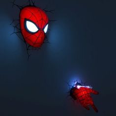 two spider - man lights up in the dark with their arms spread out and eyes glowing