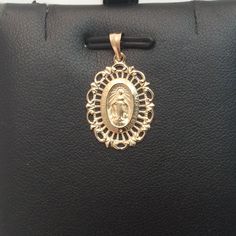 14k Yellow Real Solid Gold Oval Virgin Mary Miraculous Medal With A Beautiful Frame Charm Pendant 1.50gr Metal Type: 14k Solid Yellow Real Gold Weight: 1.50 Grams Width: 14.80 Mm Wide Length: 1 Inch Long With Bail Comes With A Gift Box Retail $969.00 14k Yellow Gold Jewelry With Miraculous Medal, Yellow Gold Oval Pendant For Anniversary, Oval Yellow Gold Filigree Jewelry, Elegant Miraculous Medal Round Pendant Jewelry, Elegant Round Miraculous Medal Jewelry, Elegant Miraculous Medal Jewelry For Gift, Elegant Miraculous Medal Jewelry Gift, Elegant Miraculous Medal Jewelry, Elegant Oval Necklace With Miraculous Medal