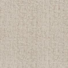 an upholstered beige fabric textured with small, white dots on the surface