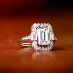 This ring is currently sold and is a ring that our jewelers can recreate with any size emerald cut diamond. If you are interested in recreating this ring, please feel free to contact us. Gia Certified Emerald Cut Art Deco Diamond Ring, Classic Octagon Diamond Ring With Baguette Diamonds, Art Deco Emerald Cut Diamond Ring With Baguette Diamonds, Gia Certified Classic Rectangular Diamond Ring, Classic Gia Certified Rectangular Diamond Ring, Classic Emerald Ring With Baguette Diamonds In Radiant Cut, Classic Octagon Emerald Ring In Platinum, Gia Certified Emerald Cut Art Deco Rings, Classic Octagon Ring With Baguette Diamonds