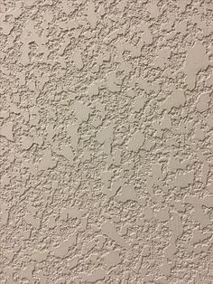 an image of a textured wall with white paint