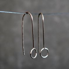 Minimalist silver wire earrings, dainty and delicate.  These geometric threaders are super lightweight and very comfortable to wear. You'll forget that you have them on. They look awesome for any occasion, discrete and simple but unique and elegant.  The total drop length measures about 1 3/16 inches (30mm). The idea behind this design was to create a pair of earrings with an elegant and simple look easy to match with any outfit. Choose between solid silver, 14k rose gold filled brass or 14k yellow gold filled brass in the drop down box. The wire is hardened, which make the earrings more resistant against deforming. You will receive these earrings in box ready to give as gift. For more unique jewelry: www.etsy.com/shop/BGLASSbcn Follow me on Instagram: @bgalssbcn Thank you for visiting my Affordable Minimalist Sterling Silver Earrings, Affordable Minimalist Wrap Earrings, Cheap Minimalist Silver Jewelry, Affordable Hypoallergenic Minimalist Wrap Earrings, Drop Earrings Simple Short Silver, Cheap Dainty Earrings With Ear Wire, Cheap Silver Minimalist Linear Earrings, Cheap Minimalist Dangle Jewelry, Cheap Hand-strung Minimalist Jewelry