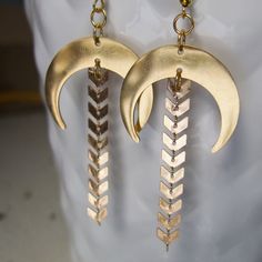 "These dangle earrings have a bit of a boho vibe with lots of bronze shimmer! I designed these drop earrings with bronze half moons made of stainless steel. Attached is a string of arrow chain with each earring measures about 3\" in length and 1\" in width at the widest point on the half moon.                                   ** If you like these, check out my half moon, star and gemstone earrings found here ** https://www.etsy.com/listing/1601797459/half-moon-dangle-earrings-with-crystal?click_key=4c46dc3412ec55d4bea0d900d061c6ec9c6b5cb4%3A1601797459&click_sum=62966322&ref=shop_home_active_1&pro=1" Brass Chandelier Earrings For Festivals, Handmade Brass Dangle Chandelier Earrings, Bohemian Bronze Chandelier Earrings With Ear Wire, Brass Chandelier Drop Earrings For Festival, Handmade Brass Chandelier Dangle Earrings, Bohemian Gold Chandelier Earrings For Festival, Brass Dangle Chandelier Earrings For Festivals, Nickel Free Brass Chandelier Earrings For Festivals, Nickel-free Brass Chandelier Earrings For Festivals