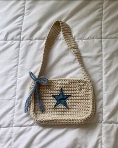 a crocheted bag with a blue star on it