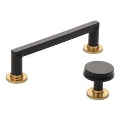 two black and gold handles on a white background with no one in the photo to describe