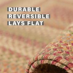 a close up of a rug with the words, double reversible lays flat