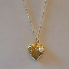 Ships Out Before 4 P.M. If Purchased Today, Sunday. Same Day Shipping When Possible For This Valentine's Day Item. New With Tags And Gift Box Included With Purchase. The Pretty, Charming Heart Locket Is Paired With A Wirewrapped Pearl. The L And W Of Locket Is A Bit Over 1/2 An Inch. And You Can Put A Picture In It. The Pearl Is 1/2 Mm. And The 18" Gold Plated Ball Chain. Buy One, I Give 10% To Charity. Handmade By Helen Flatmo. Gold Heart Locket Necklace Vintage, Gold Heart Locket Necklace, Locket Picture, Locket Vintage, Locket Necklace Vintage, Gold Heart Locket, Gold Locket Necklace, Vintage Locket, Digital Closet