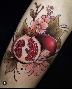 a pomegranate with flowers and leaves on the arm is shown in color