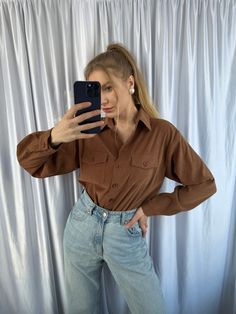 - Vintage cowboy style brown women's shirt, western style blouse - Good vintage condition  - TAG SIZE: 40 - Fabric information: 95% polyester, 5% elastane Estimated to fit XS-S-M-L  based on your desired fit. Measurements (laying flat): - Shoulders (back): 47 cm - Length: 75 cm - Sleeve: 57 cm - Armpit to armpit: 54 cm Vintage clothes may come with minor flaws due to pre-loved wear. But most importantly it is a one-of-a-kind piece with its own character. By shopping secondhand you're giving a se Brown Workwear Tops With Button Closure, Brown Button Closure Tops For Work, Brown Tops With Button Closure For Work, Brown Long Sleeve Tops With Pockets, Brown Western Style Shirt For Fall, Brown Western Shirt For Fall, Western Long Sleeve Tops For Fall, Western Style Tops With Button Closure For Fall, Casual Rodeo Fall Blouse