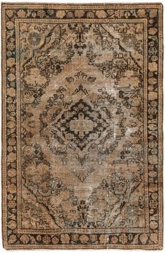 an antique rug with brown and black colors