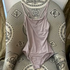 Beautiful Blush Colored Leotard - Never Worn. Smooth Material. Beautiful Back Detail. Sleeveless Bodysuit For Dance In Summer, Sleeveless Summer Dance Bodysuit, Sleeveless Bodysuit For Summer Dance, Summer One-piece Dancewear Leotard, Summer Dancewear Bodysuit For Dance, Summer Dancewear Leotard With Built-in Bra, Summer Dancewear Bodysuit, Seamless, Seamless Summer Bodysuit For Dancewear, Summer Dance Bodysuit With Built-in Bra