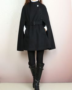 * A cool and long woolen cape coat, very elegant. * With black buttons and fully lined with lining. * Material: 50% wool, 50% polyester. Shop sizing chart FYI ( actual body figures, not laying flat clothes measurements) Size XS (US 2, UK 6, German 32, French 34) Bust: fits bust around 33.5 inches/85cm Waist: fits waist around 26 inches/66cm Hips: fits hips around 36 inches/91cm Size S (US 6, UK 10, German 36, French 38) Bust: fits bust around 35.5 inches/90cm Waist: fits waist around 28 inches/7 Chic Black A-line Outerwear, Black Cape Poncho For Work, Black Workwear Poncho Cape, Elegant Cape Wool Coat For Work, Chic Black Wool Cape, Fall Wool Cape Coat For Work, Winter Wool Poncho For Work, Long Sleeve Wool Cape For Fall, Chic Wool Cape For Fall