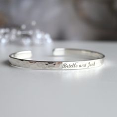 If you're wondering what to get a future Daughter in Law, here's a very memorable gift. The bracelet comes personalized with any words, symbols or your handwriting.  - Open hammered Sterling Silver bracelet - The bracelet can be engraved with any text, up to 90 characters on each side.  - Many fonts and symbols (and also handwriting) available  If you want to see the draft of the engraving, please send me the text and font via message. I will prepare and send you the draft. You can any text, her Adjustable Sterling Silver Bracelet For Anniversary, Engraved Name Bangle Bracelet As Gift, Anniversary Engraved Sterling Silver Name Bracelet, Sterling Silver Name Bracelet With Engraving For Anniversary, Classic Engraved Sterling Silver Bracelet For Anniversary, Adjustable Name Bracelet With Engraving Option For Anniversary, Anniversary Engraved Sterling Silver Bracelet, Customizable Silver Jewelry For Anniversary Gift, Classic Bracelets For Wedding And Mother's Day