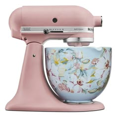 a pink mixer with flowers painted on it