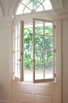 an open window with the light coming in from it's center and side windows