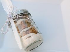 a jar filled with food sitting on top of a table