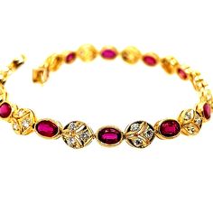 A Magnificent 5.46 carat 18k Yellow Gold Natural Ruby and Diamond Bracelet.  The piece is set with 13 oval natural rubies weighing 4.55 carats, along with 39 natural rounds weighing 0.91 carats.  The length is just over 6.75" inches, and weighs 11.6 grams. Round Diamond Bracelet, Wedding Jewelry Bracelets, Fine Jewelry Bracelets, Natural Ruby, Wedding Bracelet, Natural Red, Round Diamond, Diamond Bracelet, Round Diamonds