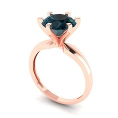 a rose gold engagement ring with a blue diamond