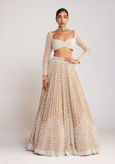 Editor's Note Make a regal entrance in this enchanting beige chandelier pearl lehenga, beautifully paired with a full sleeve pearl drop blouse. The intricate chandelier pearl detailing on the lehenga adds a touch of opulence and grandeur, while the full sleeve blouse with delicate pearl drops exudes elegance and sophistication. This ensemble is perfect for weddings, receptions, or any special occasion where you want to shine like a true queen. Note: Hanging tassel at the back and belt is not inc Dupatta Draping With Belt, Dupatta With Belt, Beige Lengha, Beige Chandelier, Pearl Lehenga, Biology Diagrams, Vani Vats, Three Tiered Skirt, Full Sleeve Blouse