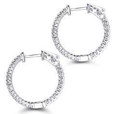 Gorgeous Diamond Hoops! These 1 inch Inside Out Diamond Hoop Earring by Luxurman feature inside out design and showcase 0.6 carats of sparkling round diamonds, each masterfully prong set in luscious 14K gold frame. Featuring a luxurious inside out design, a highly polished gold finish, and secure lock closures, these fantastic small diamond hoop earrings are available in 14K white gold, yellow gold and rose gold. Small Diamond Hoop Earrings, Diamond Hoop Earrings Small, Diamond Earrings For Women, Gold Diamond Hoop Earrings, Classy Earrings, Pave Diamond Earrings, Diamond Huggie Earrings, Diamond Jewelry Store, Diamond Hoop Earrings