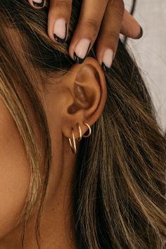 14k Gold-Filled Endless Hoop Earring Collection. Must-have delicate hoop earrings with minimal post tube closure. Set to accompany you all day + all night in pure comfort. Sold separately for you to create your own unique, every-day cascading ear stack. ✦ 14k Gold-Filled ✦ Small - 9mm / Medium - 12mm / Large - 16mm *Sold as a single earring* This item is FINAL SALE Instructions: To open- gently pull apart then gently twist to one side to create an opening to pierce your ear. Do not pull too far Womens Ear Piercings Ideas, Womens Ear Piercings, Piercing Party, Ear Piercings Ideas, Ear Stacking, Piercings Ideas, Gold Hoop Earring, Unique Symbols, Cute Ear Piercings