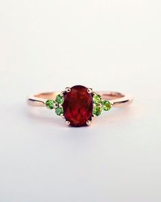 This is a very elegant and dainty ring with natural red garnet and tsavorite gemstones. It is a very bright combination and the colors are just amazing ♥ Main image displays green tsavorite and another ring on a hand is with green peridot ♥ The design can be made with gemstones of your choosing ♥ Each order will be gift wrapped beautifully ♥ QUALITY: Each item is stamped according to US regulations. ➤ Orders of $550 and more will be qualified for free UPS International Express shipping (2-3 days Tsavorite Garnet Ring, Red Gemstone Jewelry, Different Engagement Rings, Red Garnet Jewelry, Bright Palette, Gold Ring For Women, School Jewelry, Tsavorite Garnet, Green Garnet