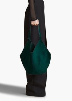 A scarf-inspired tote designed to be especially lightweight, with rounded base for stability. Includes removable leather pouch and dust bag. Designer Green Shoulder Bag With Large Capacity, Green Hobo Bag With Leather Handles For On-the-go, Luxury Green Top Handle Bucket Bag, Elegant Green Top Handle Bucket Bag, Luxury Green Bucket Shoulder Bag, Green Top Handle Bucket Bag For Travel, Green Top Handle Bucket Bag, Green Bucket Bag With Detachable Handle, Elegant Green Bucket Bag With Large Capacity