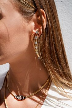 A daring silhouette from the Together Collection, these drop earrings are the epitome of timeless beauty. The complex construction of each piece in this collection is hidden for the fit to be adjustable and flexible for each wearer. An exemplary tribute of Nikos Koulis' intricate techniques and master craftsmanship: these earrings feature a delicate chain crafted as embroidery effortlessly paired with surprising layers of stones. Sophisticated drama meets exceptional elegance in this modern show Fine Jewelry Linear Pierced Earrings For Evening, Fine Jewelry Linear Earrings For Evening, Elegant Metal Linear Earrings For Evening, Elegant Metal Ear Cuff For Evening, Elegant Metal Ear Cuff For Party, Luxury Linear Earrings For Party, Elegant Metal Linear Earrings For Formal Occasions, Luxury Metal Drop Clip-on Earrings, Luxury Metal Drop Earrings