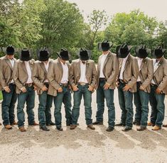 a group of men wearing cowboy hats standing next to each other