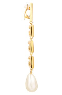 Bring Dolce&Gabbana's signature glamour to any look with these clip-on earrings flaunting goldtone logos and lustrous baroque imitation pearls. Clip-on style Nickel-free Hypoallergenic Goldtone plate/acrylic imitation pearl Made in Italy Designer Gold Drop Pearl Earrings, Designer Gold Pearl Drop Earrings, Elegant Gold-tone Linear Earrings, Luxury Single Linear Earring For Evening, Luxury Gold-tone Clip-on Jewelry, Luxury Metal Clip-on Earrings For Evening, Elegant Gold-tone Dangle Clip-on Earrings, Luxury Metal Clip-on Jewelry, Gold-tone Clip-on Evening Jewelry