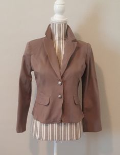 "Vintage Steampunk blazer size large has a steampunk/Victorian style. It is unique and stylish. Laying the garment flat bust measures 38\" waist measures 32\". For a better visual, the mannequin's measurements are bust 34\" waist 25 ½\"." Winter Costume Blazer With Long Sleeves, Fitted Outerwear For Cosplay In Spring, Brown Fitted Gothic Outerwear, Fitted Outerwear For Spring Costume Party, Winter Cosplay Long Sleeve Blazer, Costume Long Sleeve Blazer, Tailored Costume Blazer, Fitted Long Sleeve Blazer For Cosplay, Brown Tailored Blazer For Party