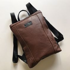 Small Brown Leather Backpack Versatile Brown Leather Backpack, Brown Leather Shoulder Bag For Commuting, Brown Backpack With Adjustable Strap For Commuting, Brown Soft Leather Backpack For Everyday Use, Brown Satchel Bag For Commuting, Brown Leather Backpack For Commuting, Rectangular Brown Bag For Commuting, Small Leather Backpack, Brown Backpack