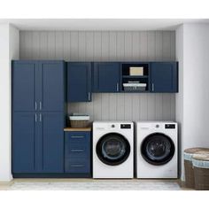 a laundry room with blue cabinets and washers