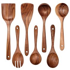 wooden utensils and spoons lined up on a white background