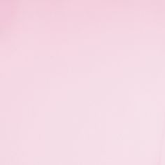 a pink background with an image of a woman's face