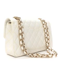 This is an authentic CHANEL Caviar Quilted Small Double Flap in White. This stunning shoulder bag is crafted of diamond quilted luxurious caviar leather in white. The bag features a gold chain-link leather-threaded shoulder strap, a rear patch pocket, and a facing Chanel CC turn lock. This opens to reveal an inner flap and a matte white leather interior with patch pockets. Chanel Caviar, Diamond Quilt, Leather Interior, White Leather, Chain Link, Gold Chain, Patch Pocket, Gold Chains, Shoulder Strap