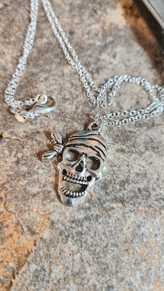 Silver tone metal pirate skeleton pendant 18 inch with sterling silver chain..Happy Halloween! Matching earrings available! Pirate Skeleton, Penny Necklace, Halloween Matching, Skeleton Earrings, Crucifix Necklace, Halloween Necklace, Pirate Skull, Pirate Costume, Skull Jewelry